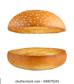 Burger Bun Empty Isolated. American Food Classic Burger Round Bun With Sesame Isolated At White Background. Burger Bun Without Ingridients. Roasted Toasted Hamburger Bun Layers Flying At White.