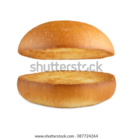 Burger bun empty isolated. American food classic burger round bread isolated at white background. Roasted toasted burger top without fillings flying, levitating at white. 