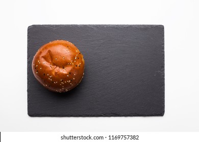 Burger Bun On Black Slate, Top View