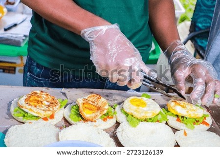 A burger bun is a type of bread specifically made to serve as a base or topping for burgers. These buns are typically round with a soft, fluffy, and slightly sweet texture. Burger buns are typically golden yellow in color due to the butter and egg content.