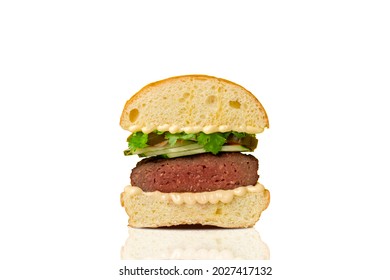 Burger cut in half on white background. Hamburger. Cheeseburger. - Powered by Shutterstock