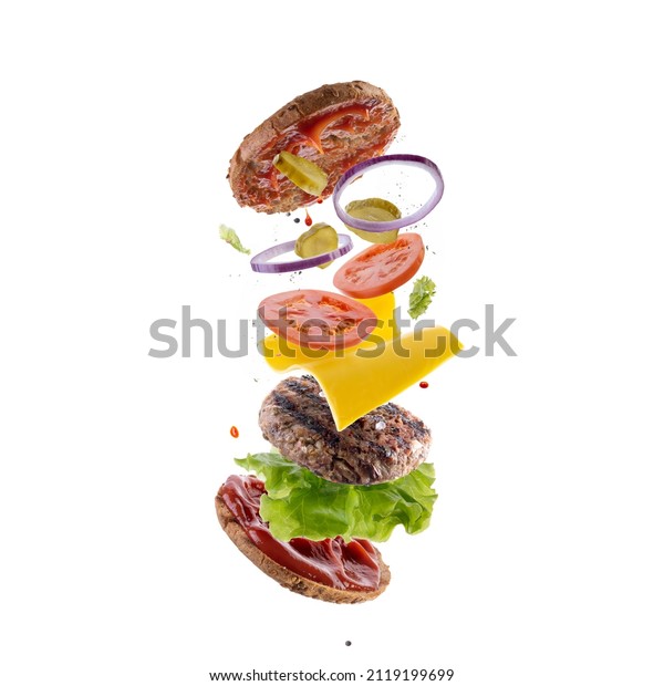 Burger with flying elements.\
Delicious burger with flying ingredients. Flying Burger\
Slices.