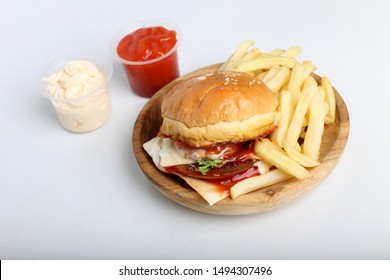 burger and fries isolated with sauce