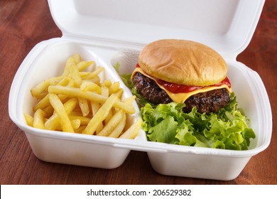 Burger And Fries Portion In Takeout Food Box