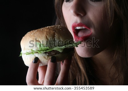 burger hamburger American junk fast food beautiful brunette girl with red lipstick on beautiful lips and beef burger with grilled bacon  hungry facial expressions 