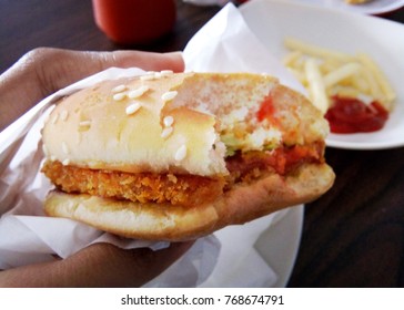 Burger/ Hamburger Sandwich Bitten , Close Up View, First Person Holding The Food