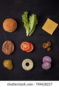 Burger Ingredients On Dark Background. Top View