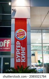 Burger King Fast Food Advertising Sign. Russia, Sochi November 2021. A Poster On A Building Column At Night.