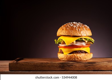 Burger On A Wooden Board