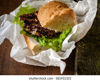 Burger (sandwich) with a cutlet and lettuce