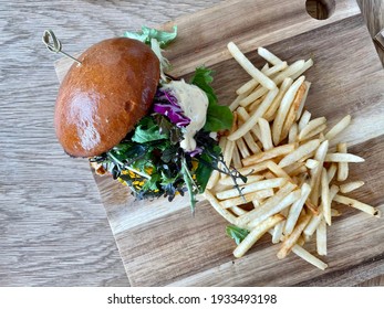 Burger With Shoestring Fries On The Board