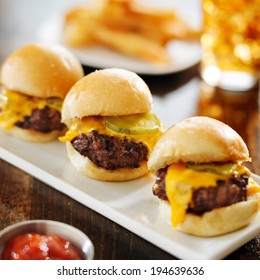 Burger Sliders With Melted Cheese And Pickle