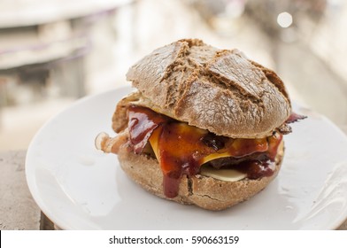 Burger Without Vegetables In Fresh Bread Roll And Bacon, Egg, Beef, Cheese And Bbq Sauce