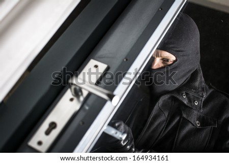 Burglar breaking in