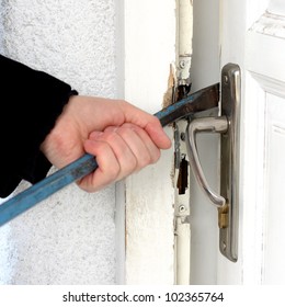 Burglar Breaking Into A House