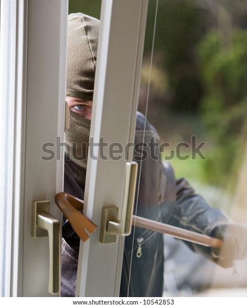 Burglar Breaks Into Residential Building Stock Photo (Edit Now) 10542853