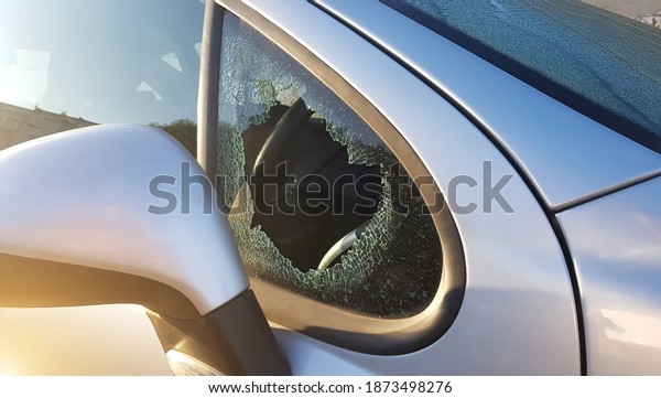 The burglar broke the side\
window of the car to steal. An example for insurance against\
robbery.