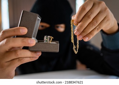 Burglar Holding Jewelry Indoor, Robbery Concept.