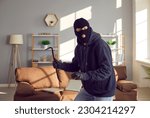 Burglar, robber, thief breaks into somebody