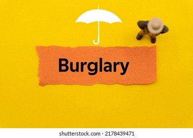 Burglary.The Word Is Written On A Slip Of Colored Paper. Insurance Terms, Health Care Words, Life Insurance Terminology. Business Buzzwords.