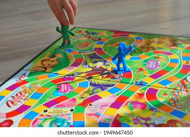 Burglengenfeld, Germany - February 2 2014: Making a move in the game of Candyland. 