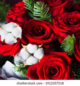 Burgundy Bouquet With Red Roses, Green Branches Of A Christmas Tree And White Flowers