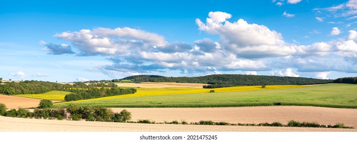 Burgundy Countryside  Landscape Of French Morvan With Green Grassy Fields And Forests Under Blue Sky With Clouds