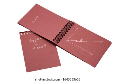 a burgundy notebook with a motivational inscription mine is success and in numbers one two three on a white background. motivation, business, success, design