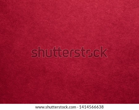 Burgundy red felt texture abstract art background. Colored fabric fibers surface. Empty space.
