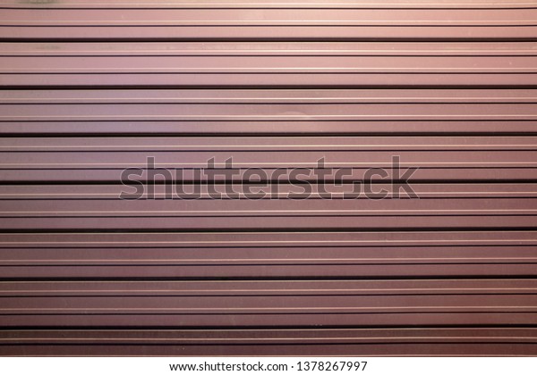 burgundy shop shutter, steel material, it can be used as\
a background. 