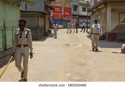 Burhanpur, Madhya Pradesh / India - April 11 2020: Covid 19 Corona Virus, Police Patrolling On The Streets Of Burhanpur During Nationwide Lockdown & Curfew. Burhanpur, Madhya Pradesh, India