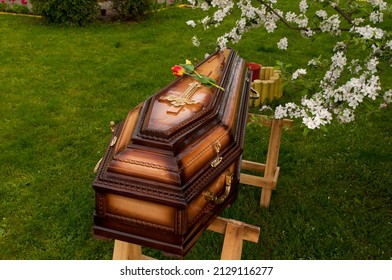Burial coffins on a background of green grass.