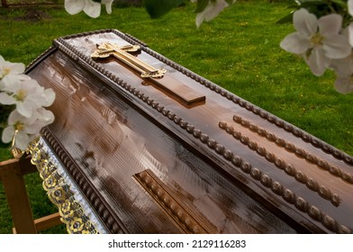 Burial coffins on a background of green grass.
