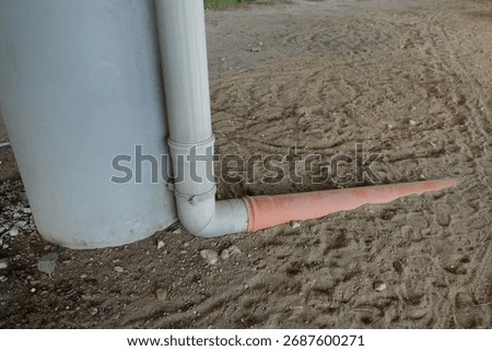 Buried gutter in the ground.