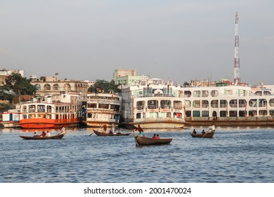 Buriganga river, Bangladesh - 27 June 2021 : Dhaka, the capital of Bangladesh is located on the banks of the river Buriganga. The Buriganga river is always busy with wooden boats and passenger ferries