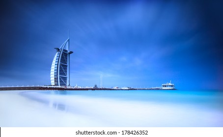 Burj Al Arab hotel on Jumeirah beach in Dubai, modern architecture, luxury beach resort, summer vacation and tourism concept