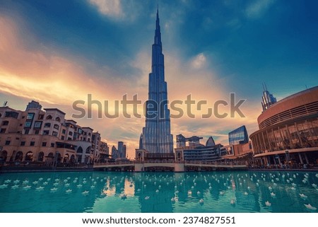 Burj Khalifa in Dubai, UAE. The tallest skyscraper building in the world, travel attraction with blue pool on foreground