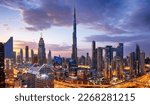 Burj Khalifa skyline in Dubai at dramatic sunset - aerial view, United Arab Emirates