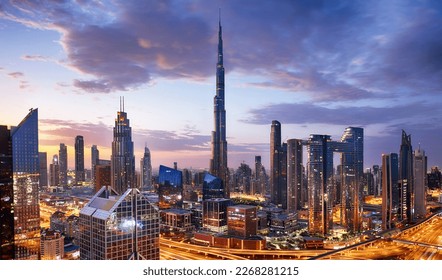Burj Khalifa skyline in Dubai at dramatic sunset - aerial view, United Arab Emirates - Powered by Shutterstock