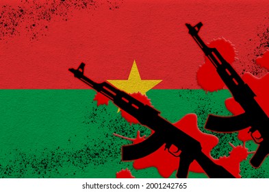 Burkina Faso Flag And Two Black AK-47 Rifles In Red Blood. Concept For Terror Attack Or Military Operations With Lethal Outcome. Dangerous Weapon Usage