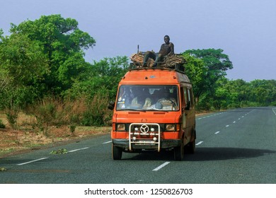 Burkina Faso, Ouagadougou - August 23, 2018: Red Bus Driving On The Street