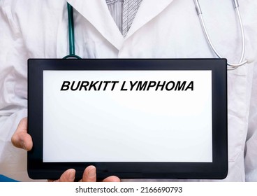 Burkitt Lymphoma.  Doctor With Rare Or Orphan Disease Text On Tablet Screen Burkitt Lymphoma