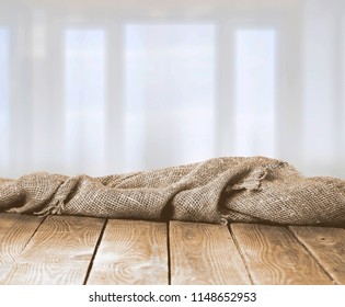 Burlap Texture On Wooden Table On Blurred