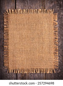 Burlap Texture On Wooden Table Background