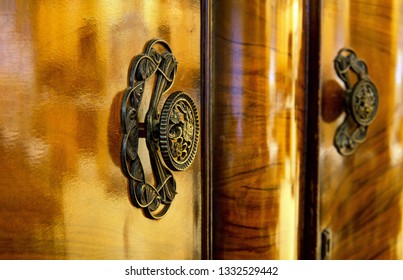 Burled Walnut Veneer With Ornate Art Deco Styled Fixture. Deep Colored Brown Antique Armoire Heirloom Classic Finished Furniture Of Years Past.