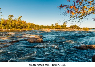 Burleigh Falls Ontario Canada Showing Water Rapids And Forest Landscape In Fall Season