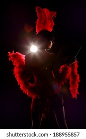 Burlesque Dancer With Red Plumage And Red Short Dress, Black And Red Background, On The Stage