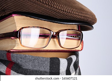 Burlesque image of the detective: books, eyeglasses, a scarf - Shutterstock ID 165607121