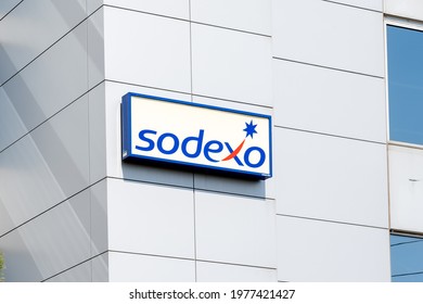 Burlington, Ontario, Canada - May 15, 2021: Close Up Of Sodexo Sign On The Building, Burlington, Ontario, Canada. Sodexo Is A French Food Services And Facilities Management Company.  