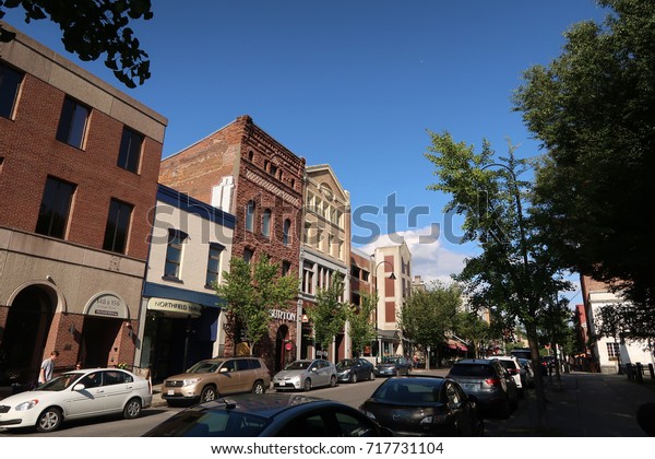 BURLINGTON,\
VERMONT - August 27, 2017: Cars and storefronts on College Street\
in Burlington, Vermont. Editorial use\
only.